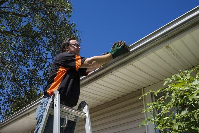 technician replacing a rusted gutter in El Monte